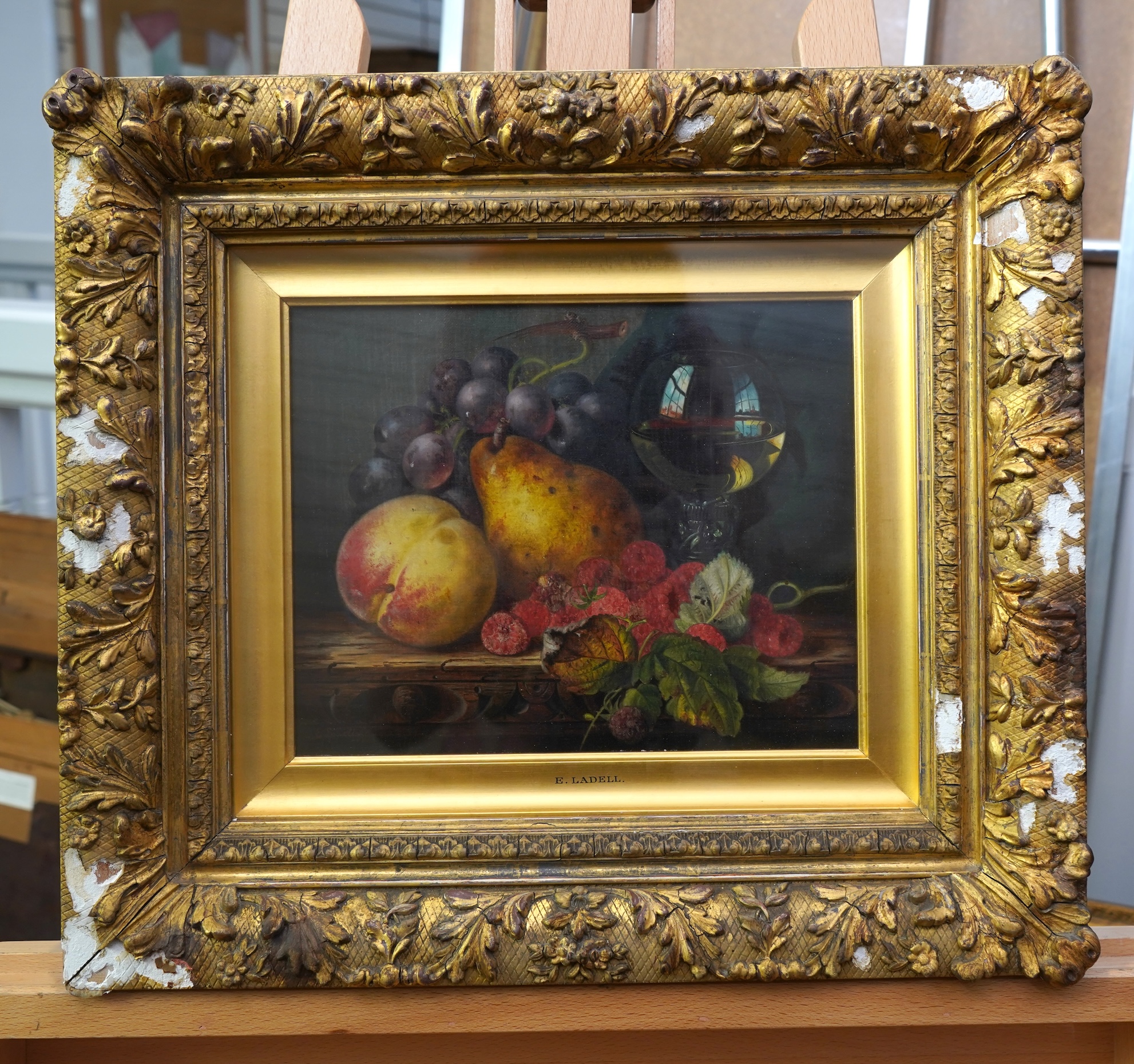 Edward Ladell, 1821-1886, A still life study of fruit and a wine glass on a tabletop